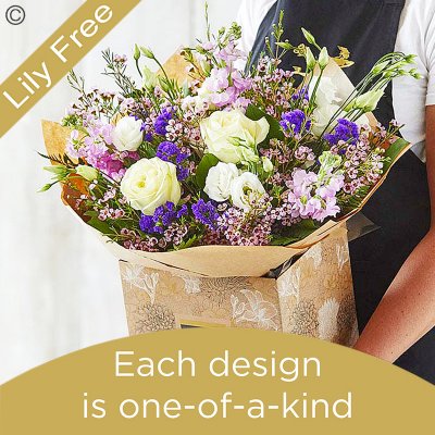 Lily Free Florists Choice Hand tied bouquet made with seasonal flowers Code: LFHT4 | National / local delivery or collect from shop