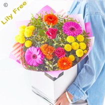 Lily Free Florists Choice Hand tied bouquet made with seasonal flowers Code: LFHT3 | National / local delivery or collect from shop