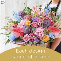 Lily Free Florists Choice Hand tied bouquet made with seasonal flowers Code: LFHT12S | National Delivery and Local Delivery Or Collect From Shop