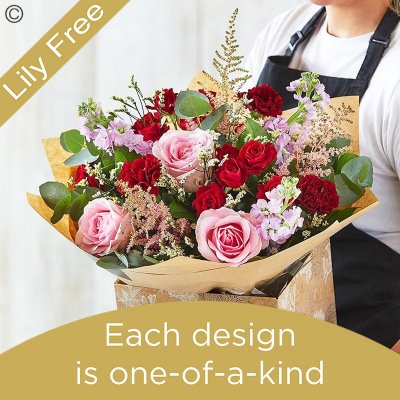 Lily Free Florists Choice Hand tied bouquet made with seasonal flowers Code: LFHT5 | National / local delivery or collect from shop