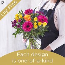 Lily free flowers in a vase in bright tones florist choice Code: LFVASE2B | National delivery and local delivery or collect from our shop