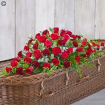 Rose and carnation red tones casket spray Code: F13590RS | National and local delivery