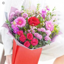 Mixed pink and red hand-tied with one red rose Code: JGFVRFHT2R | Local delivery or collect from our shop only