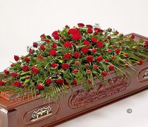 Red Rose Casket Spray Code: JGFF90854CS  | Local Delivery Or Collect From Shop Only